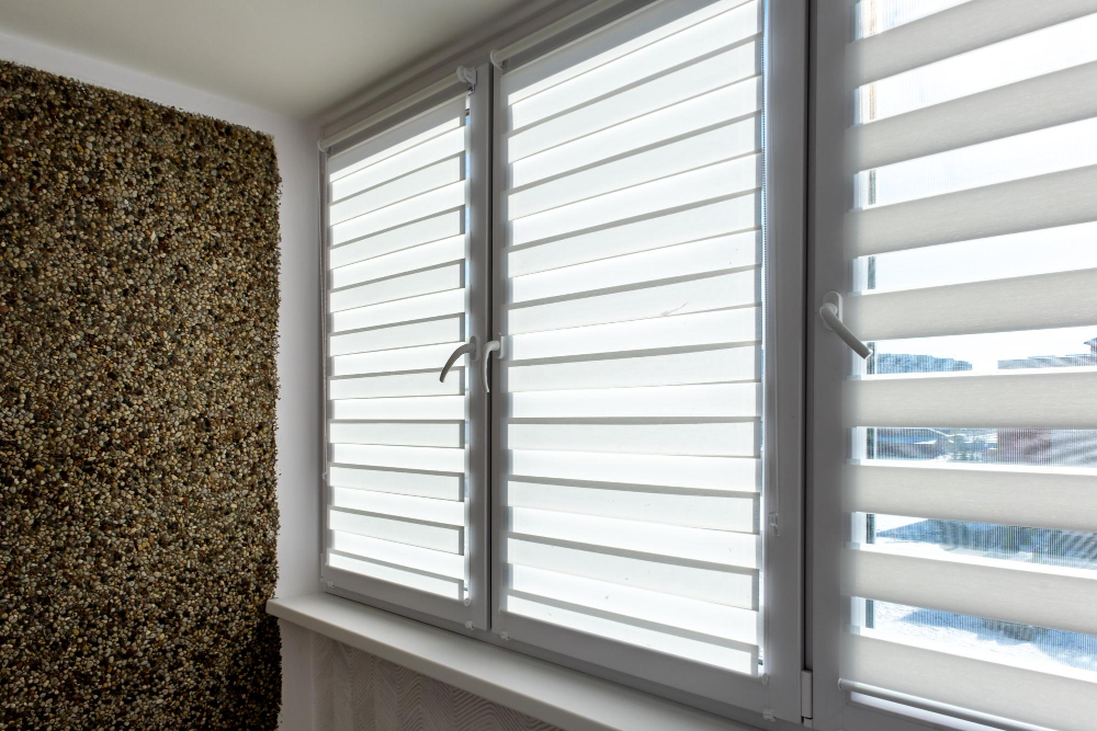 Dual layer zebra shades in contemporary bedroom